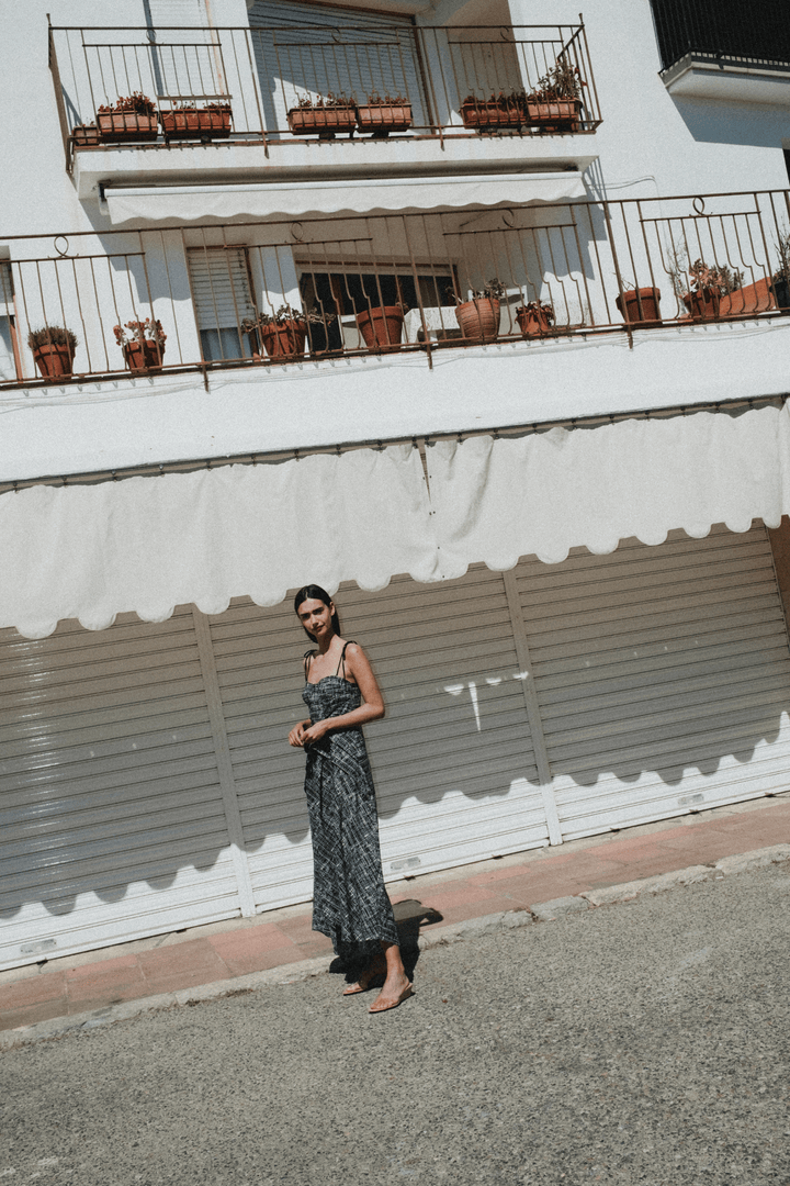 LEYA - ASYMMETRIC CUT FRONT TIED LONG DRESS - CROSSED LINES BLACK